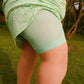 Woman wearing juniper chub rub shorts