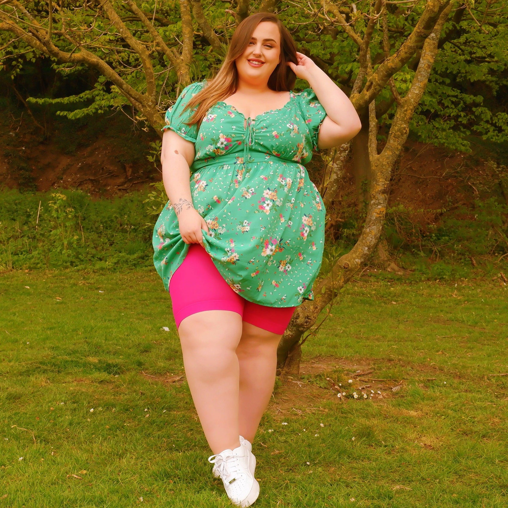 Woman wearing pomegranate chub rub shorts