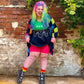 Woman wearing pomegranate chub rub shorts