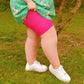 Woman wearing pomegranate chub rub shorts