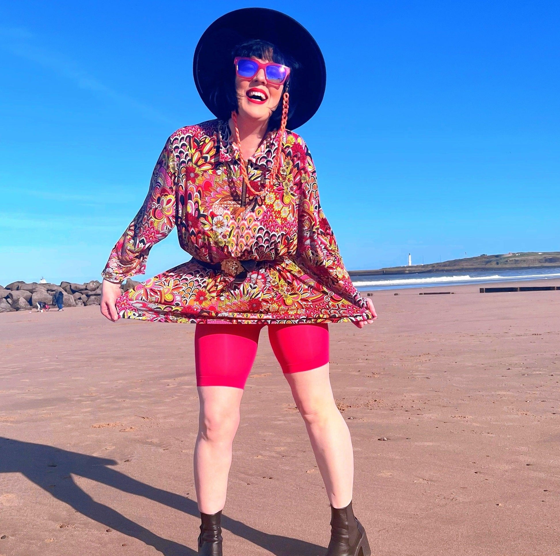 Woman wearing pomegranate chub rub shorts