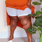 Woman wearing white chub rub shorts