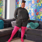 Woman wearing pink thigh high socks